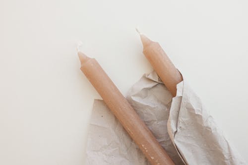 Brown Candlesticks Wrapped on Paper