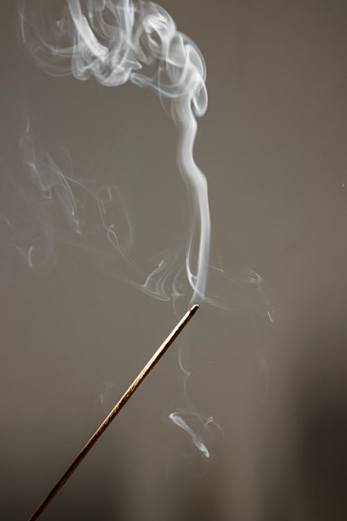 Free Selective Focus Photo of an Incense with Smoke Stock Photo