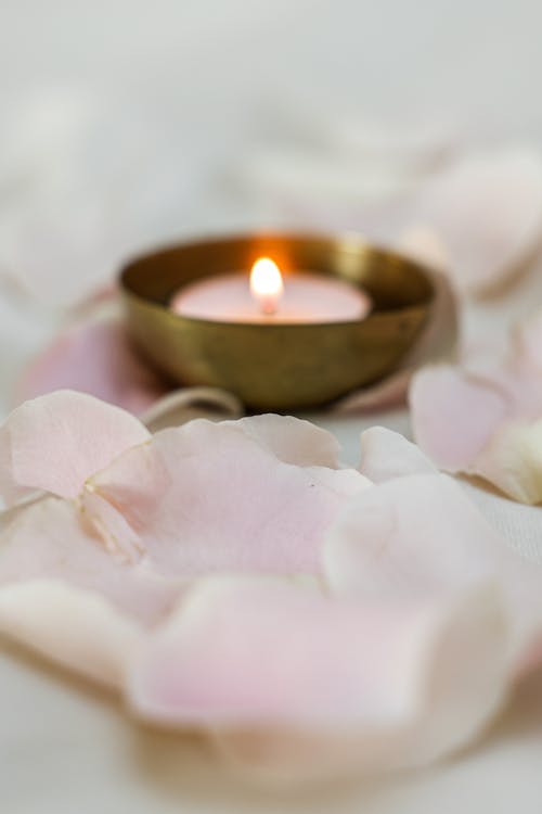 Free Lighted Candle on Gold Round Bowl Stock Photo