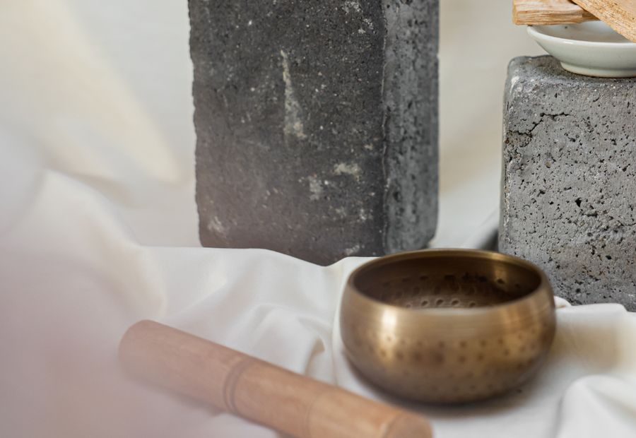 A few considered objects arranged on stone and linen