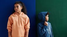 Girl in Pink Hoodie Standing
