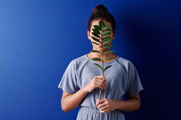 Girl Holding A Plant