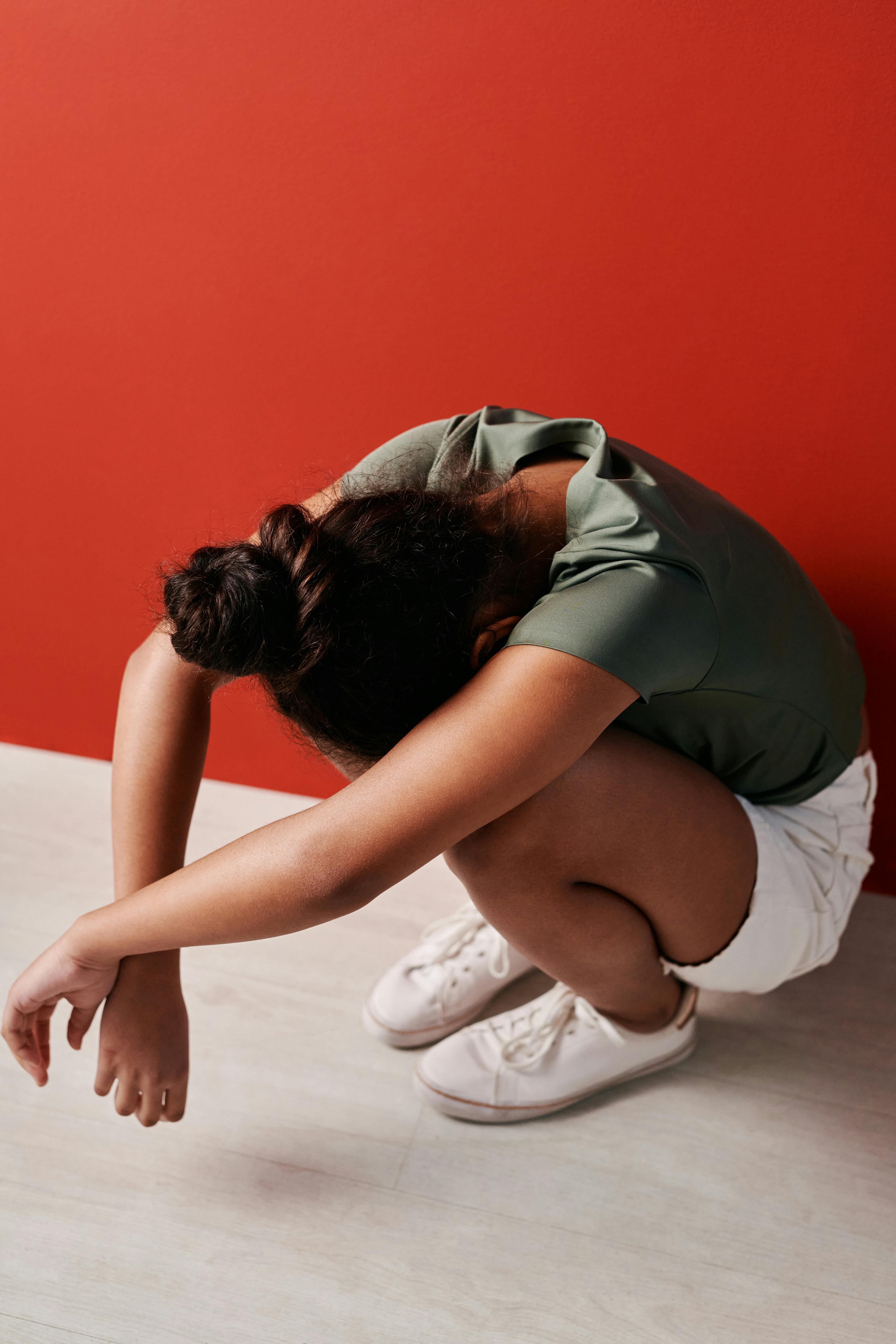 photo of an upset kid crouching