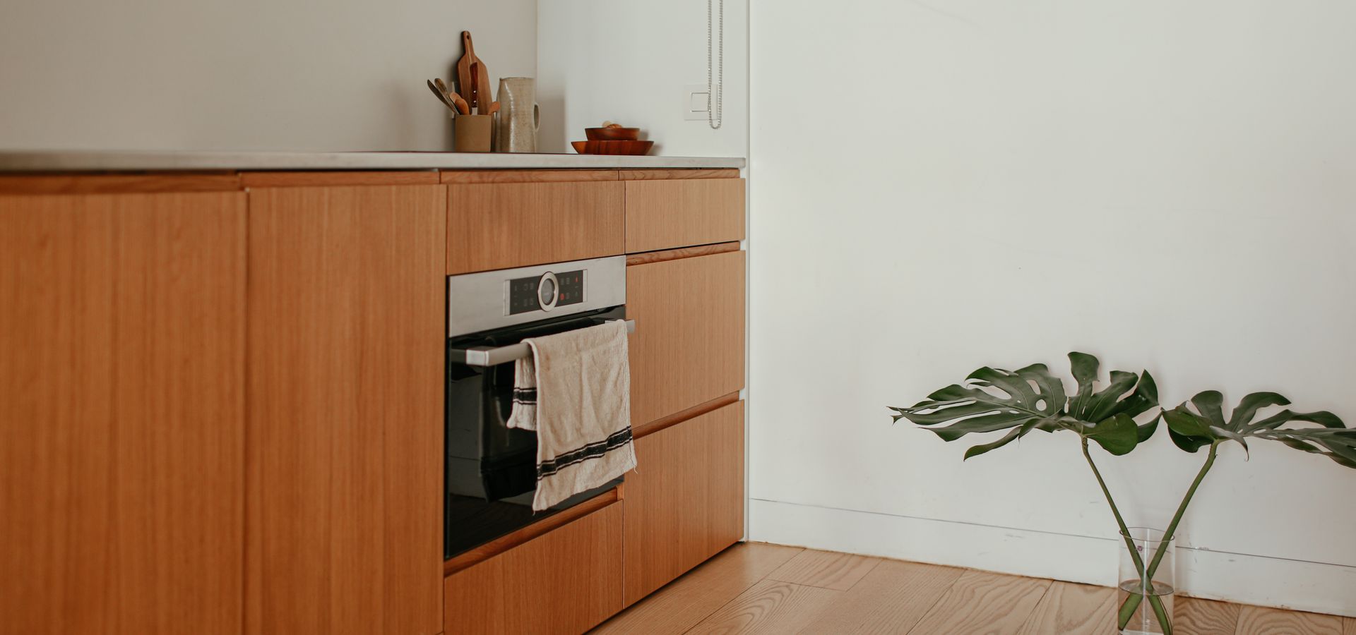 Sophisticated minimalist kitchen with timber cabinetry
