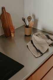 Kitchen counter with wooden utensils, photo by Cup of Couple on Pexels
