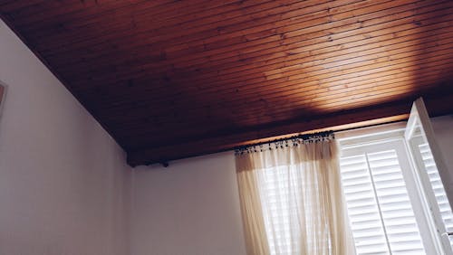 Beige Window Curtain on White Window Panel