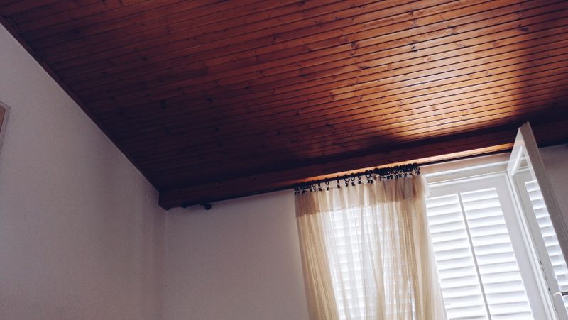 Wood Ceiling Beams Paired with Beige Walls