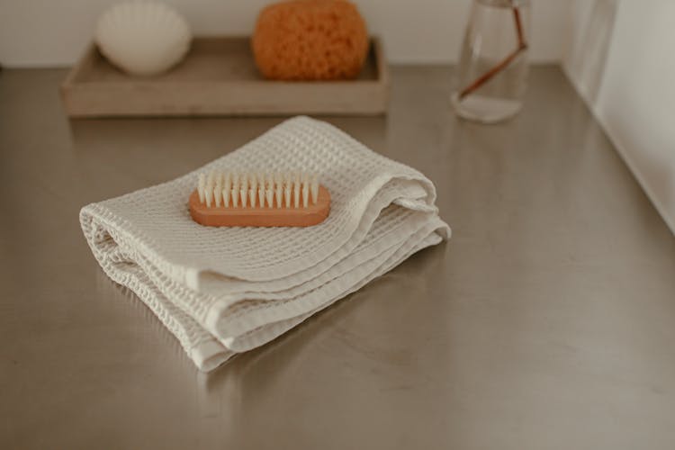 A Brush Lying On A Cloth 