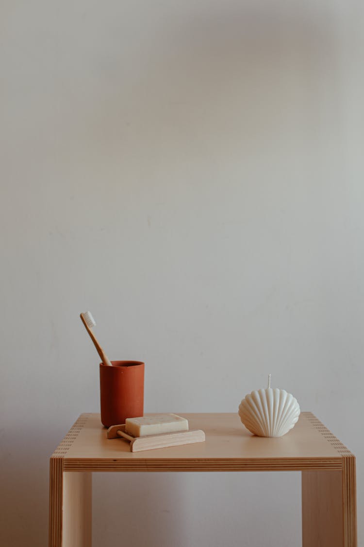 Toothbrush In A Cup, Seashell Decoration And A Soap Bar 