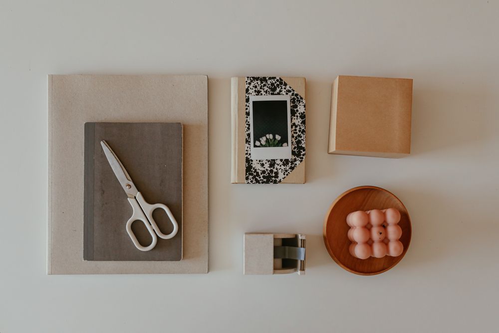 Flat-lay of notebooks and studio tools, photo by Cup of Couple on Pexels