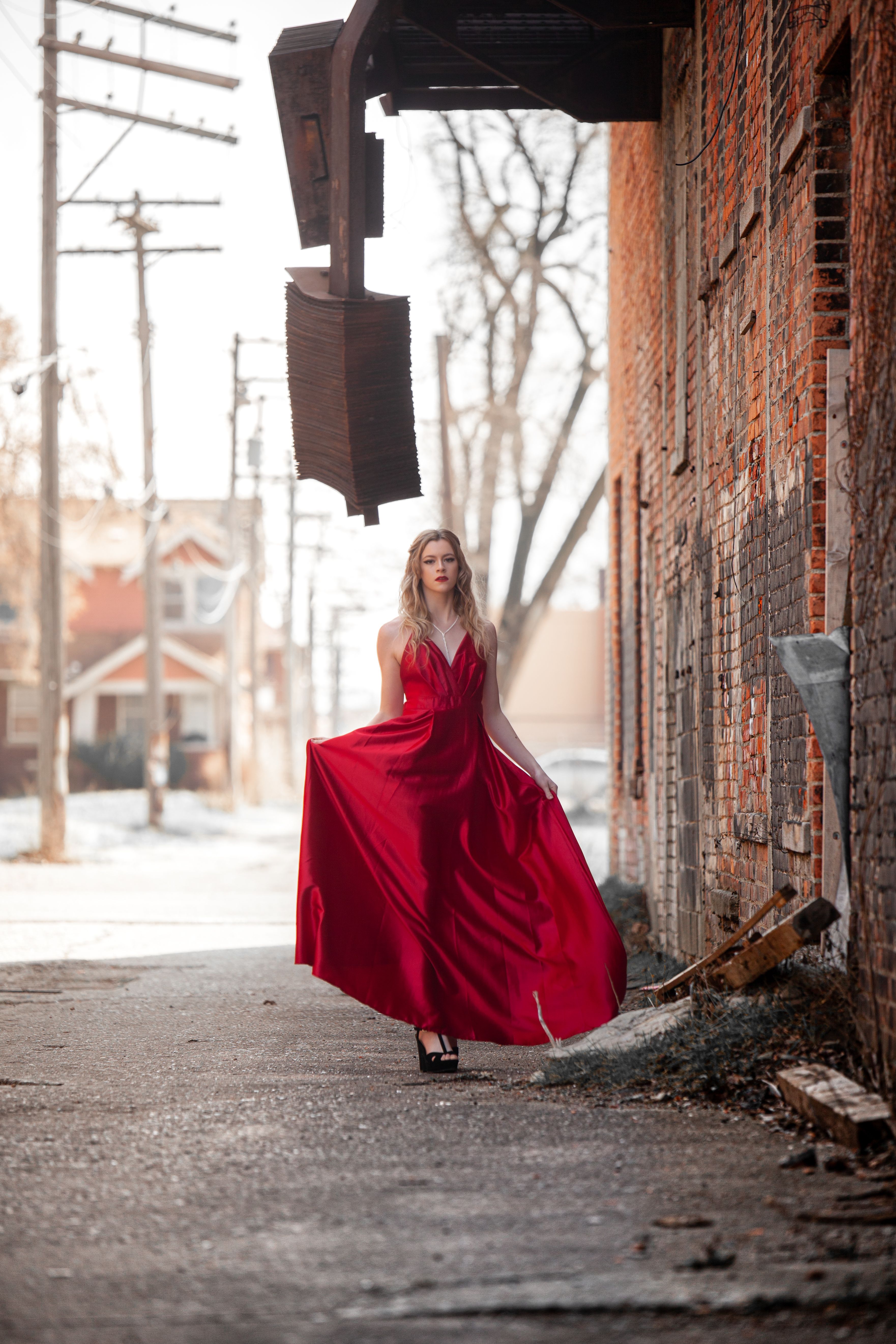 Woman in Red Dress Standing Beside the Brick Wall · Free Stock Photo