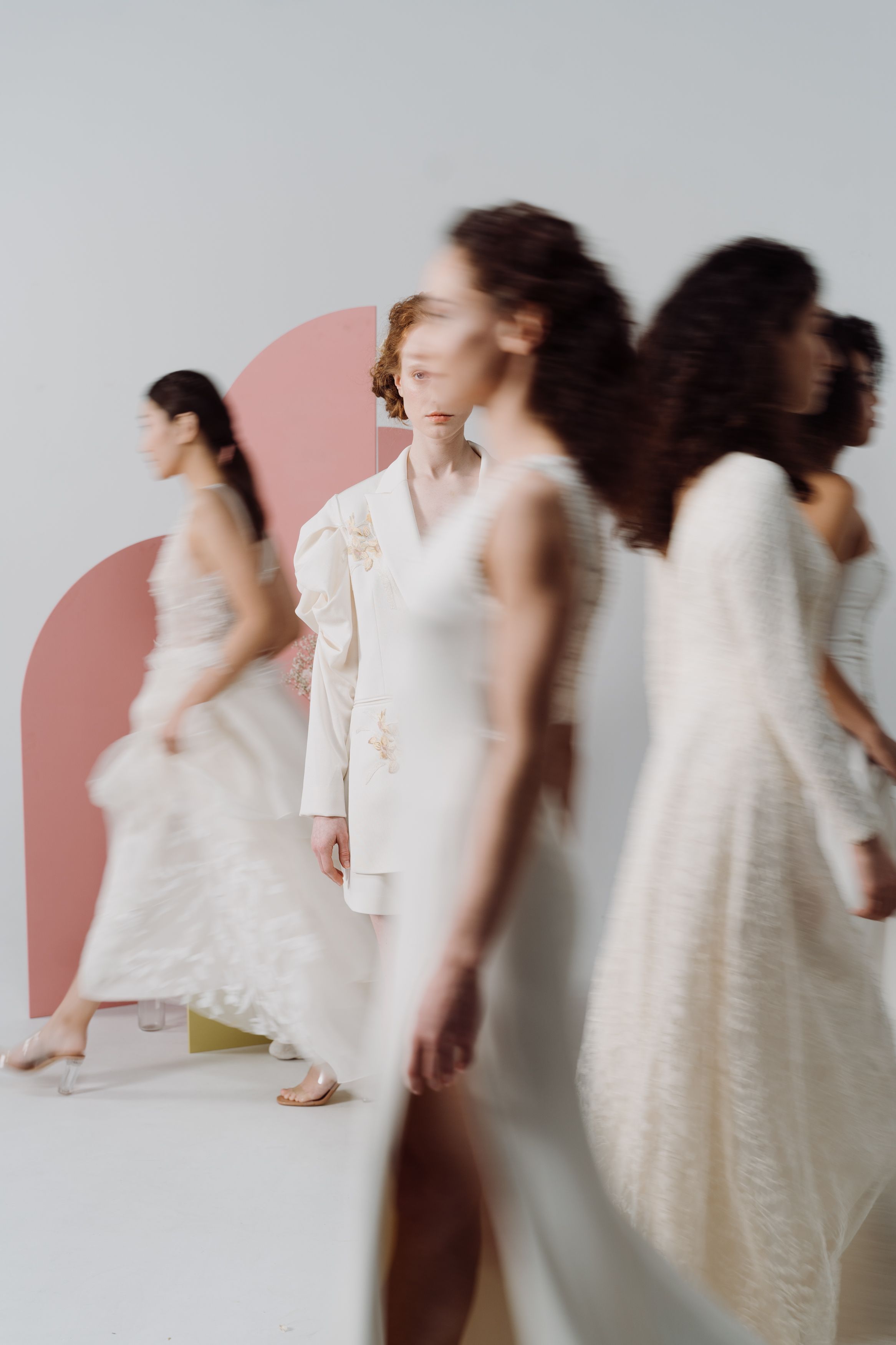 A Group of Women in White Dresses Walking · Free Stock Photo