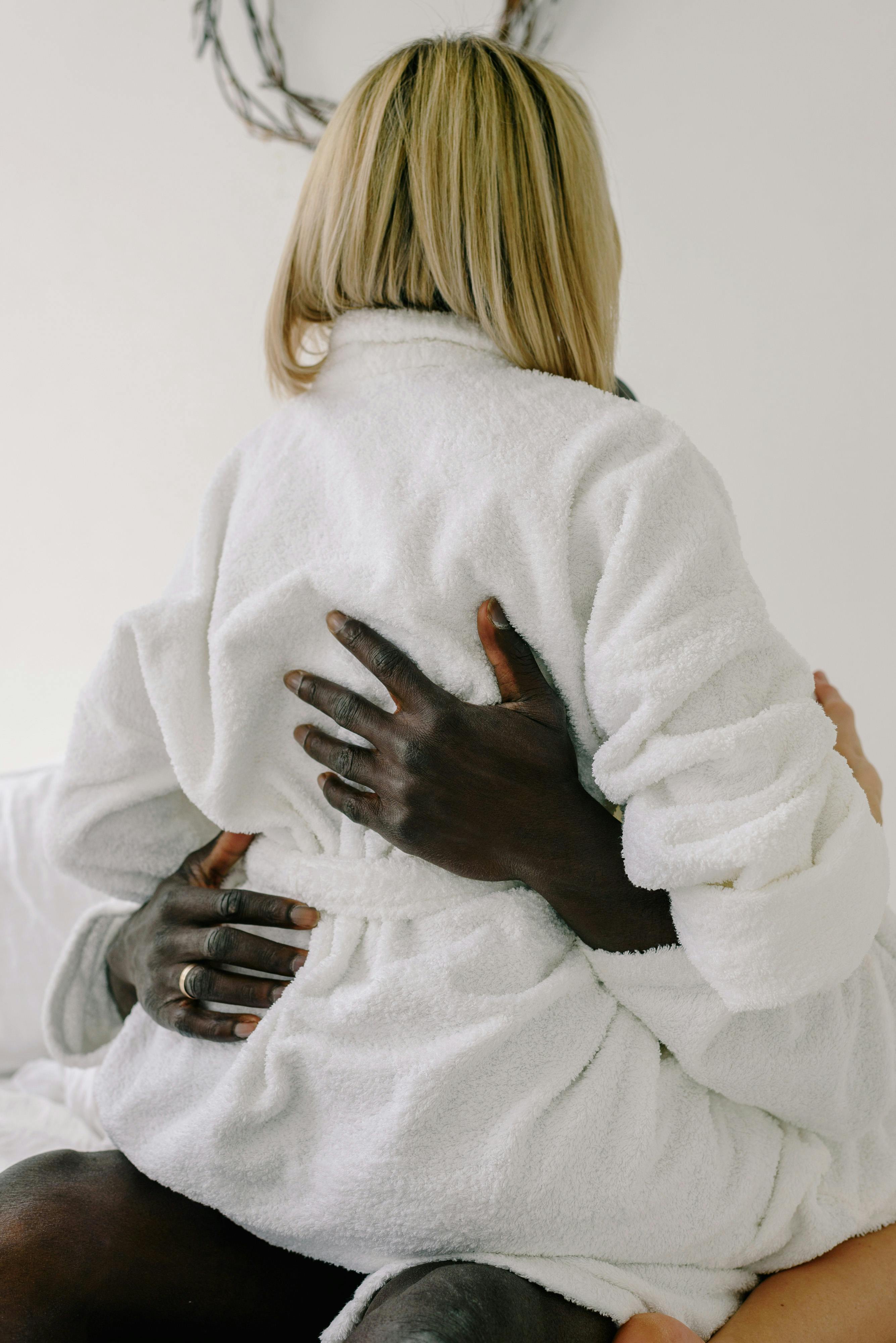 an intimate couple wearing bathrobes