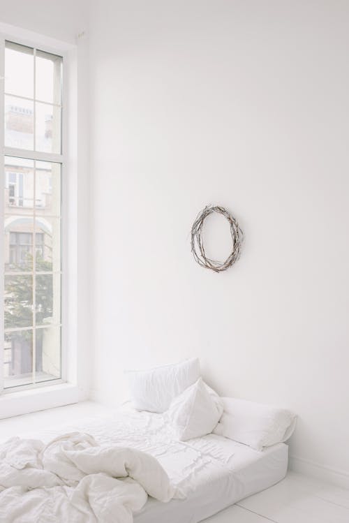 Free An Empty Room With a Bed  Stock Photo