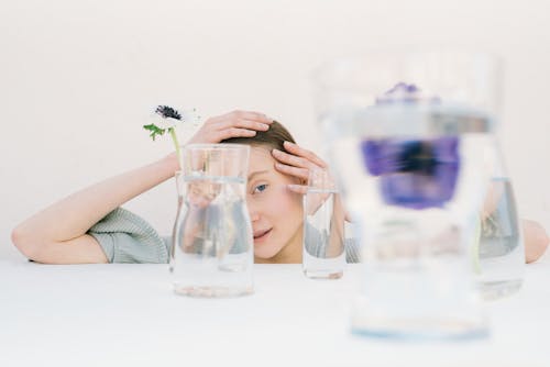 Kostenloses Stock Foto zu blühen, glas, halbes gesicht