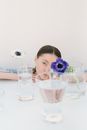 Woman in White and Black Stripe Shirt Holding Clear Drinking Glass