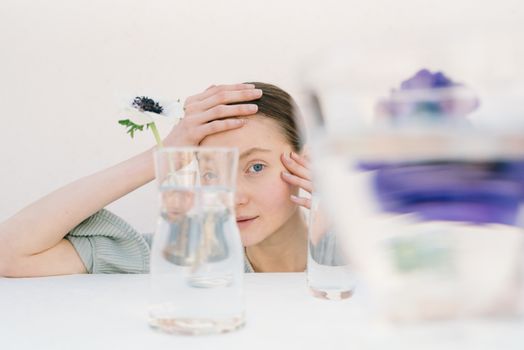Woman behind a Glass Container