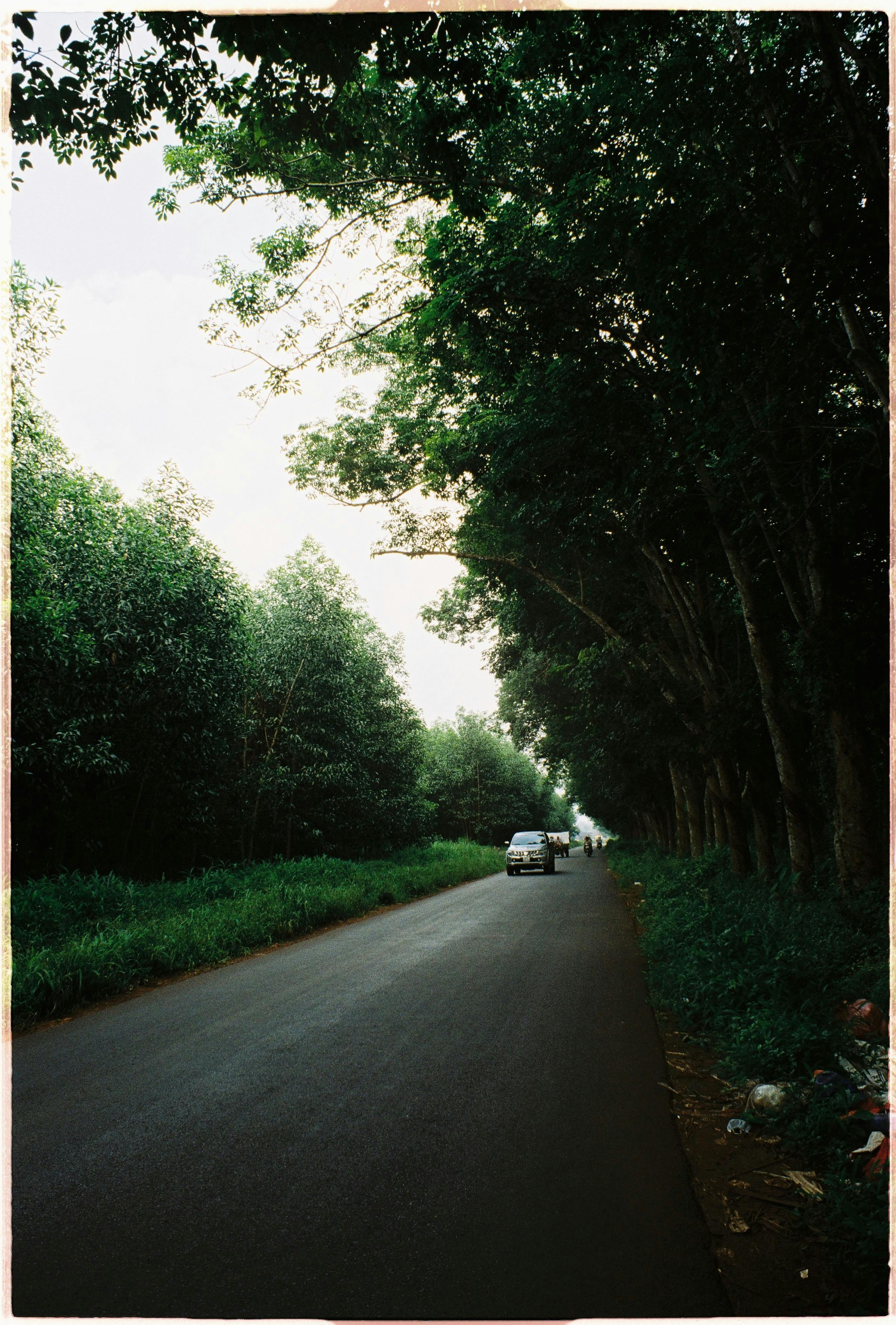 Multiple screens showing social media feeds and crypto ETF charts at a trading desk