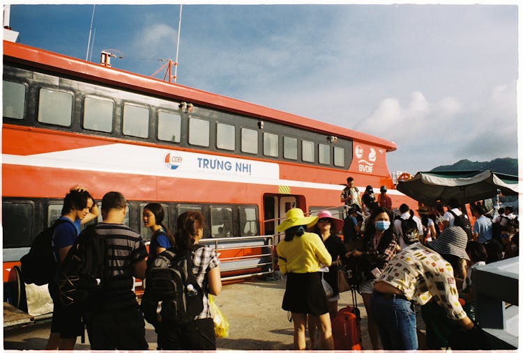 Busy Commuters Standing Outside A Ferry Boat