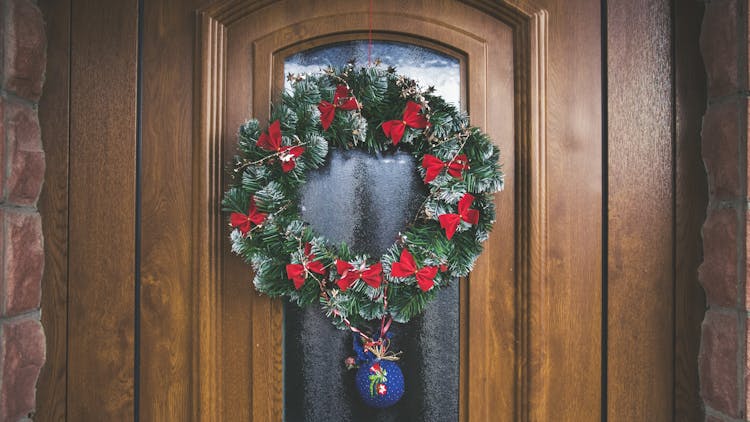 Green And Red Christmas Wreath On Door