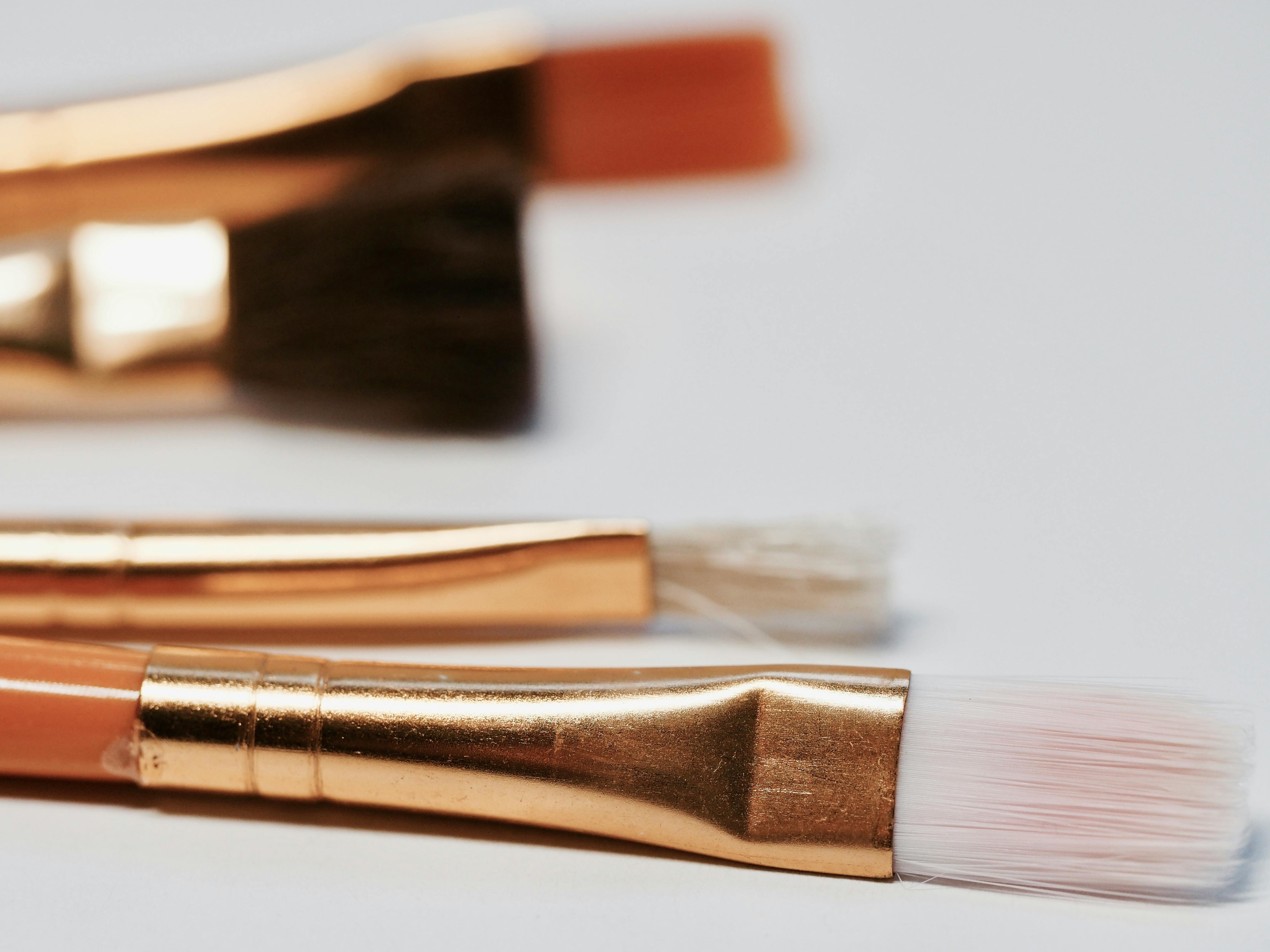 selective focus photography of brown makeup brush kit