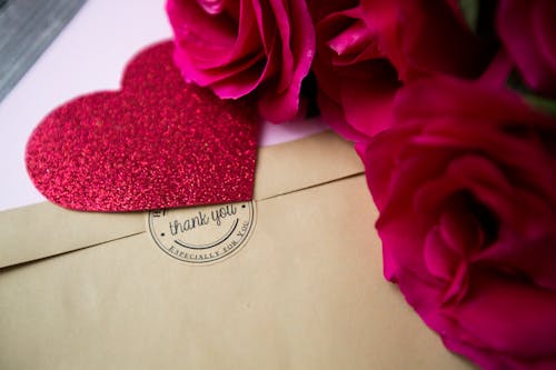 Photo of a Love Letter Near Roses