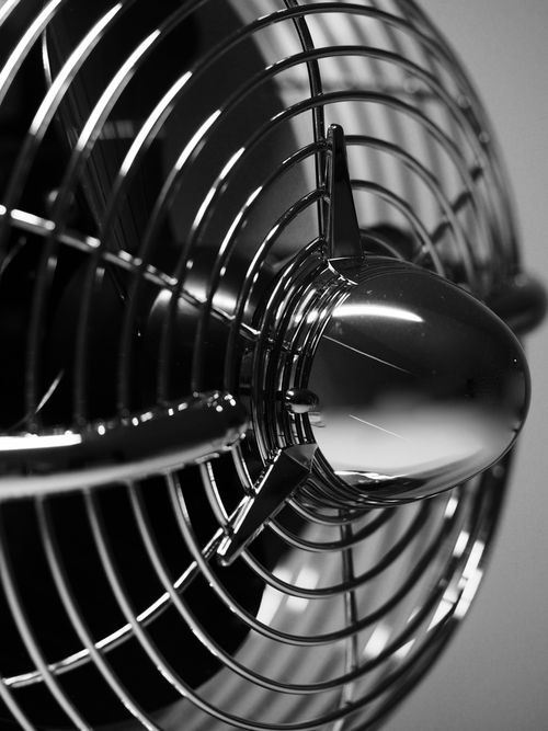 Free Detailed black and white image of a metallic fan with intricate design. Stock Photo