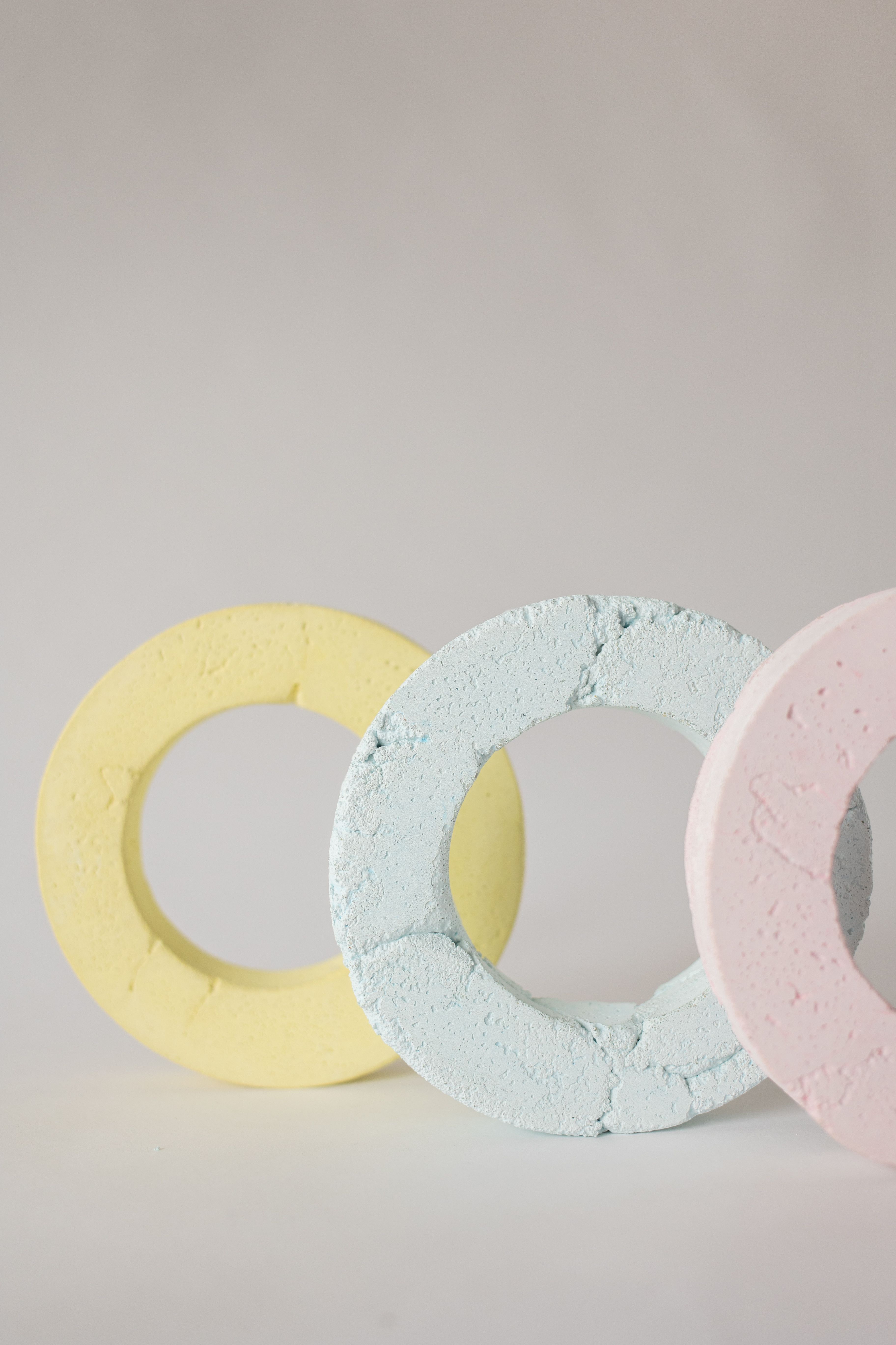 Photo of a Yellow Ring Beside a Blue Ring · Free Stock Photo