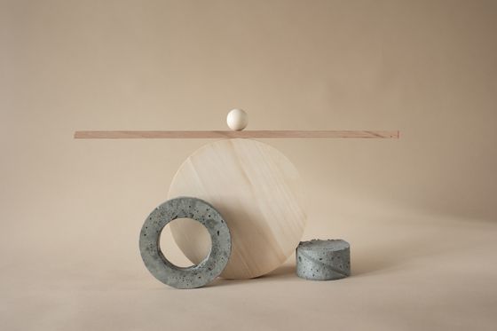 Still life of balanced geometric shapes on a beige backdrop &mdash; photo by Katrin Bolovtsova on Pexels