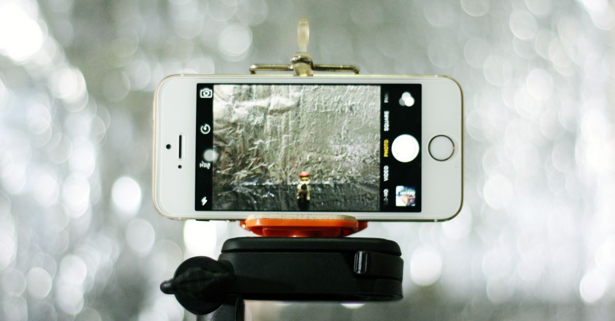 A smartphone mounted on a tripod