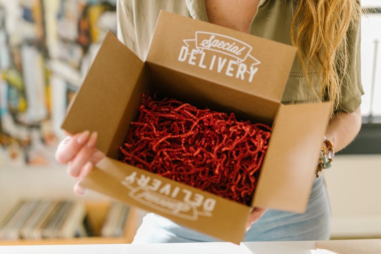 A Box With Red Packing Fillers