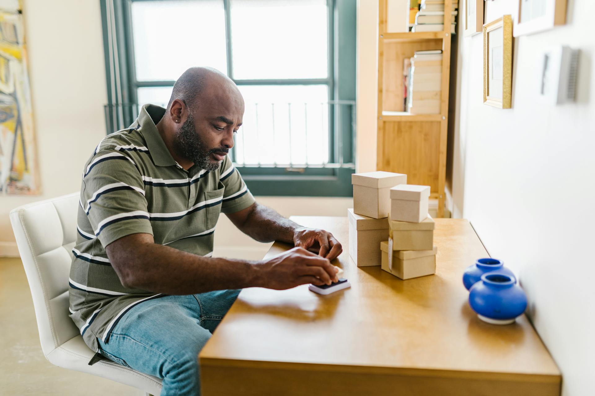 Man Putting Stamps in Ink Pad