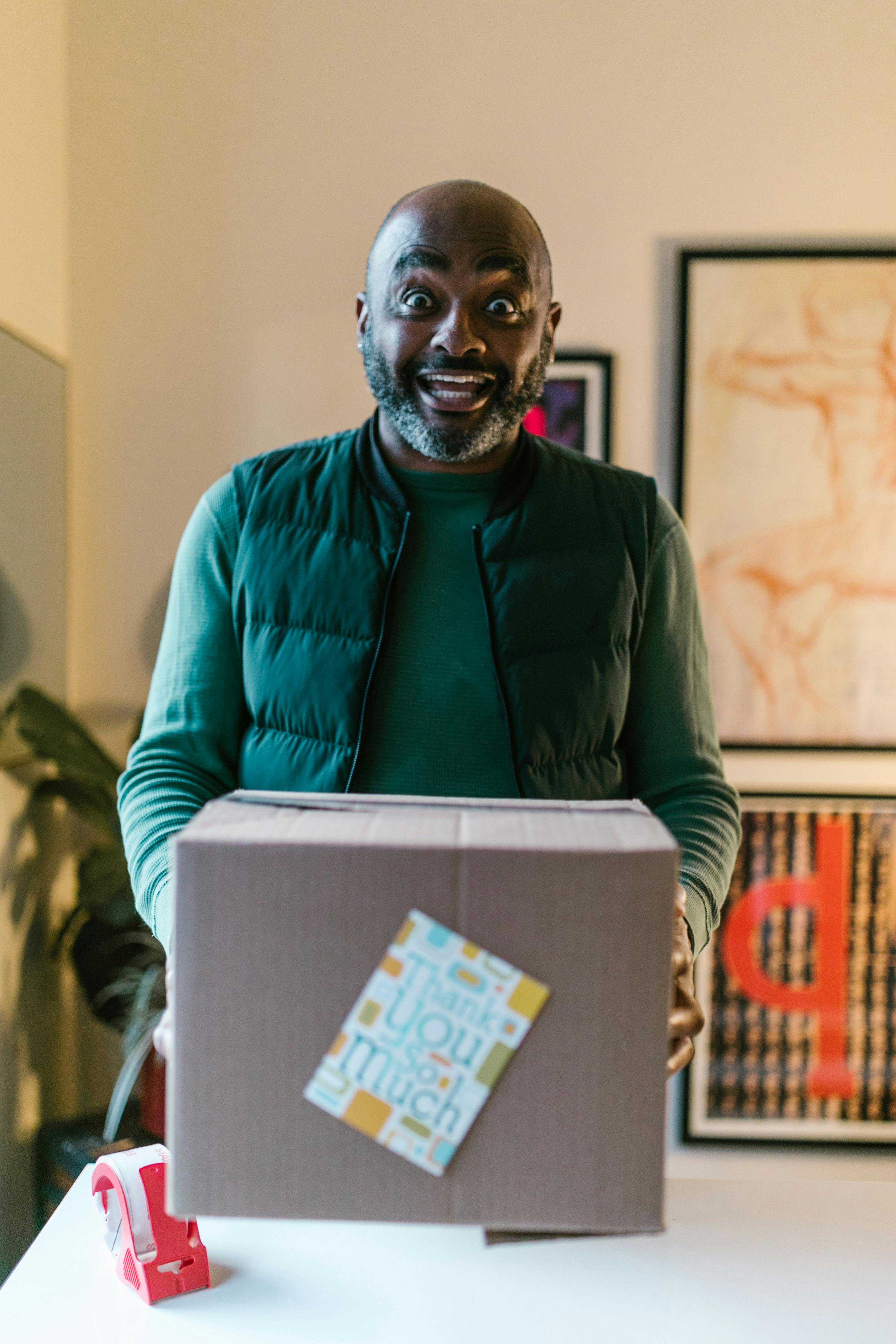 a man holding a cardboard box