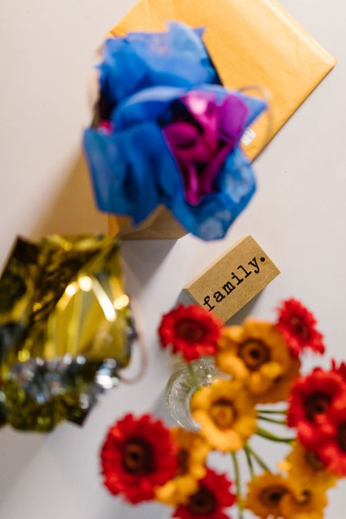 Free Bright floral arrangement with a 'family' note, perfect for celebrations. Stock Photo