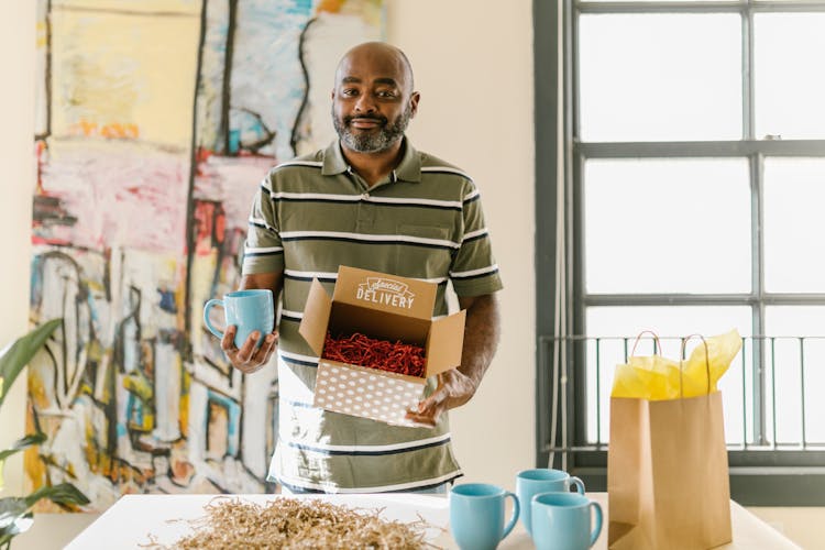 A Man Packing Cups For Delivery