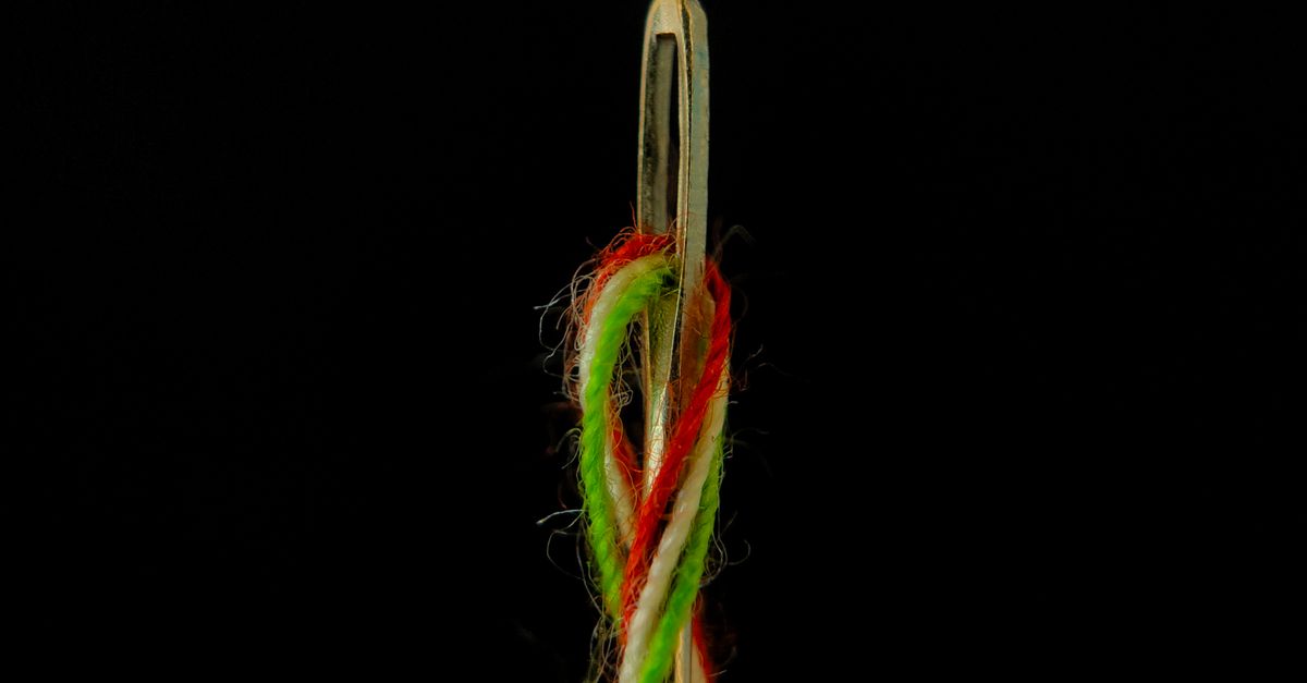 Close-up of Colorful Threads Coming Through the Needle Eye · Free Stock ...