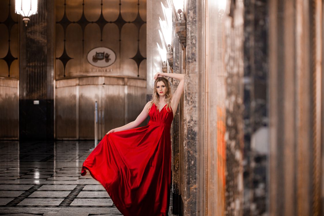 A Pretty Woman in Red Dress Leaning on the Wall  Free Stock Photo