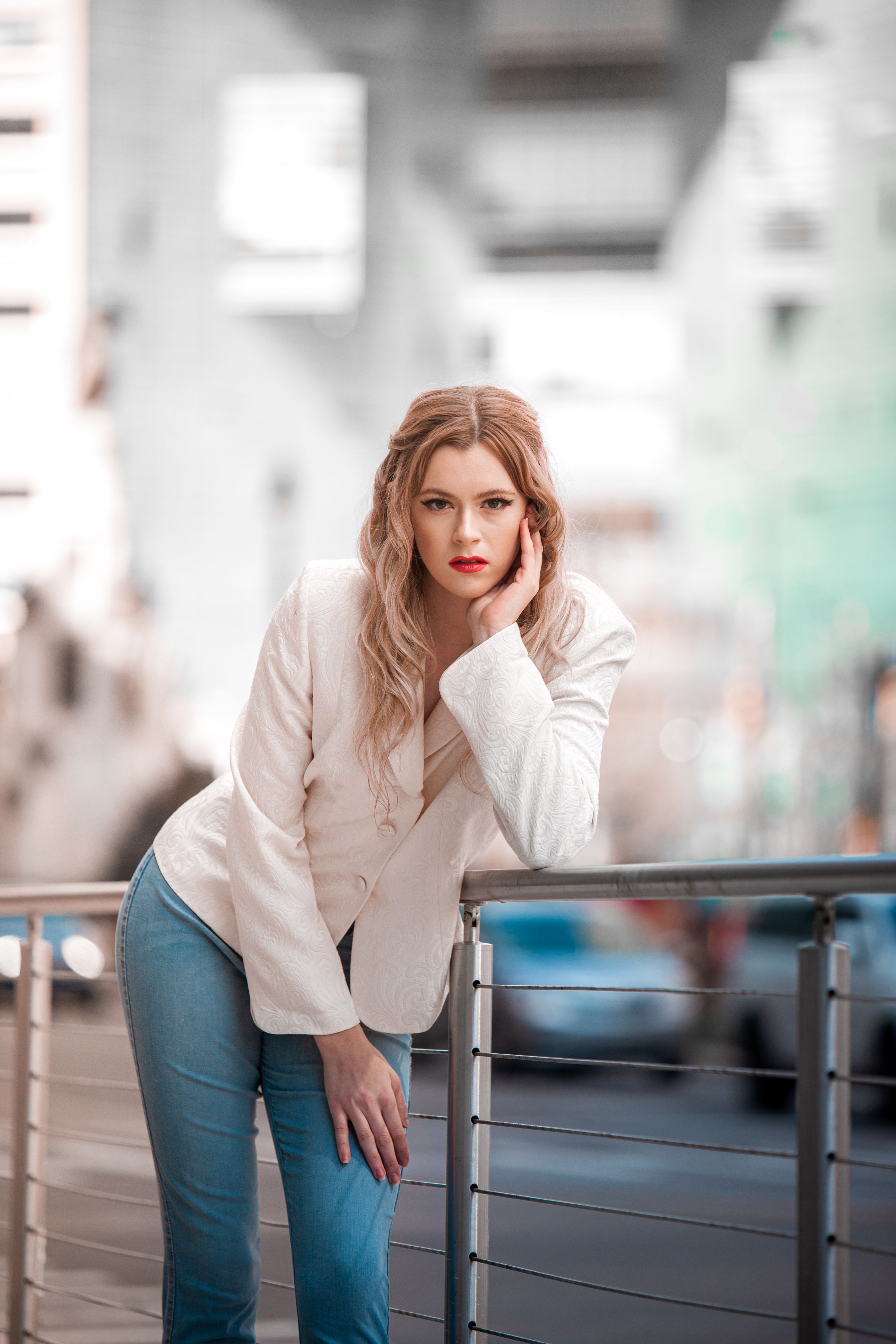 A Woman in White Blazer While Posing · Free Stock Photo