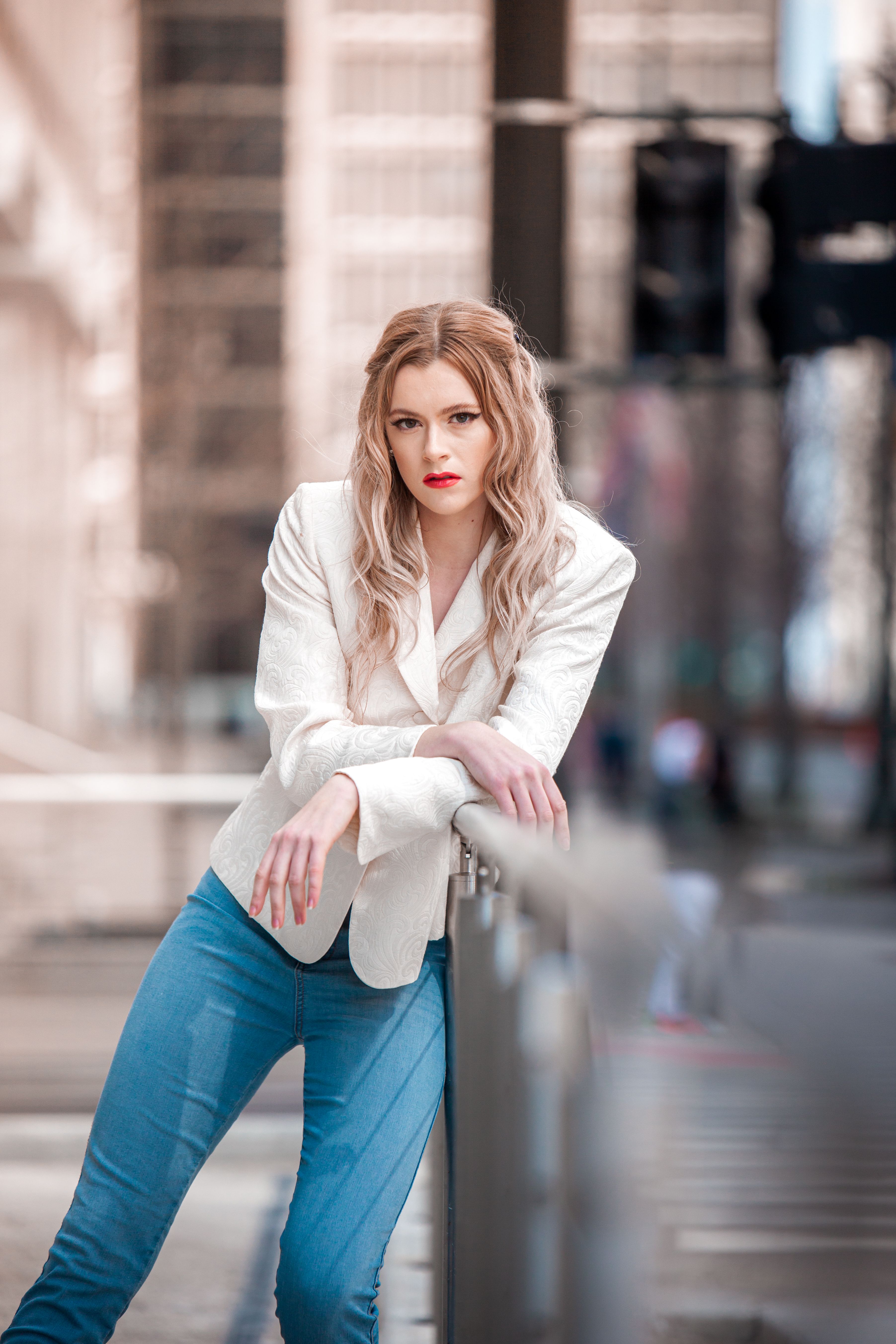 Woman wearing a blazer with jeans, casual chic brunch