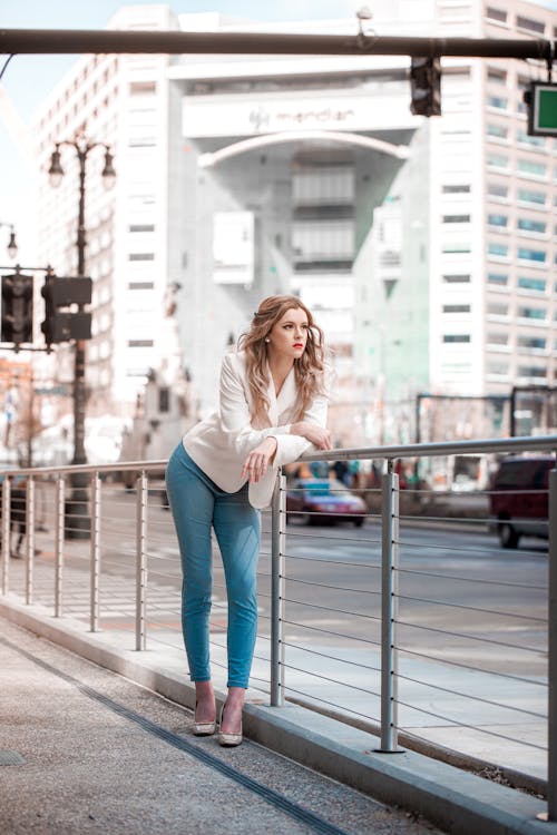 Free A Woman Posing on the Railings  Stock Photo