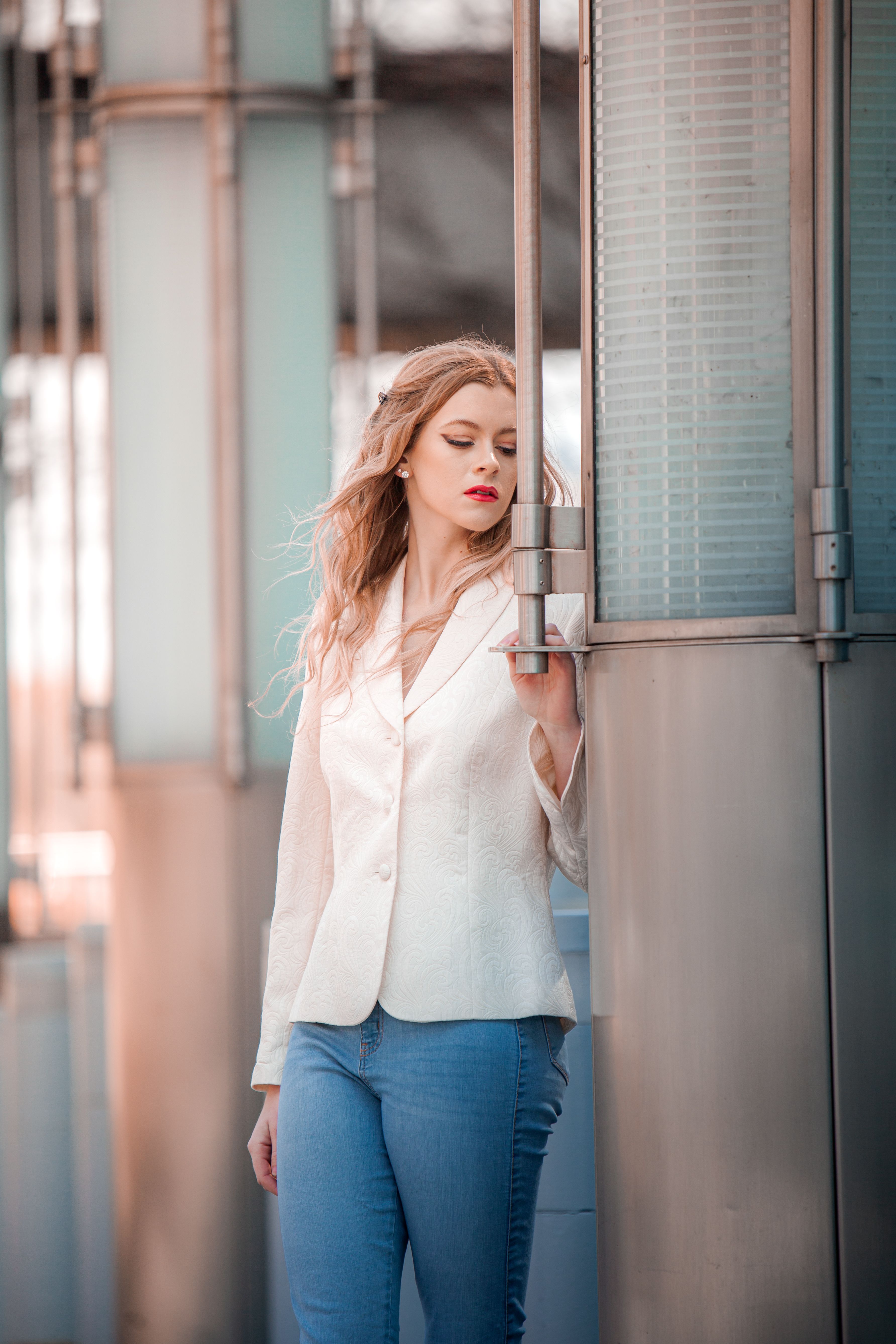 A Woman in White Blazer Standing Beside the Door · Free Stock Photo