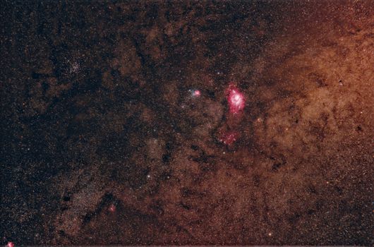 Beautiful view of the starry night sky featuring a prominent nebula and countless stars, ideal for astronomy enthusiasts.