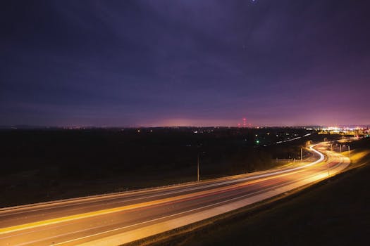 Captivating night shot of highway light trails using long exposure technique.