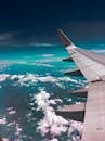 Airplane Wing Above Clouds