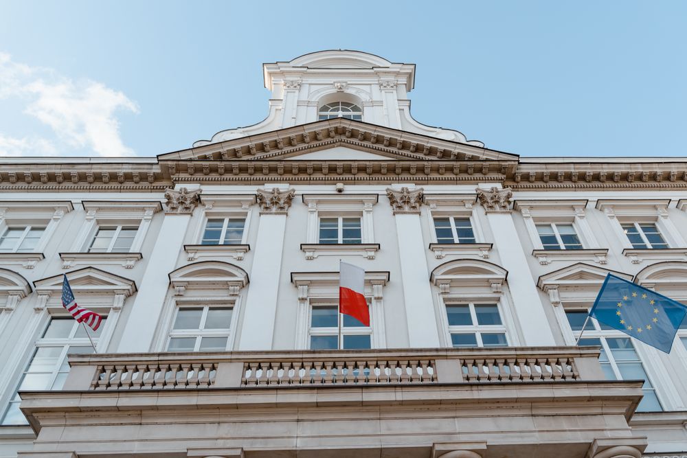 Diplomatic mission facade with international flags