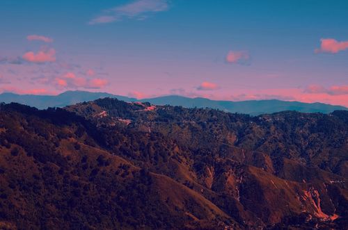 Free Experience the vibrant sunset casting warm hues over the scenic mountains of Baguio in the Philippines. Stock Photo