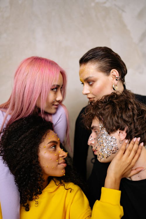 A Group of People with Glitter Make Up