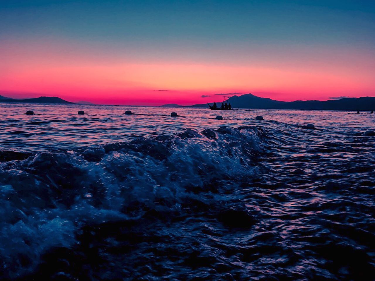 stunning sunset over ocean waves creating a dramatic seascape with sil