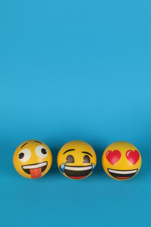 Free Emoticons over Blue Background Stock Photo