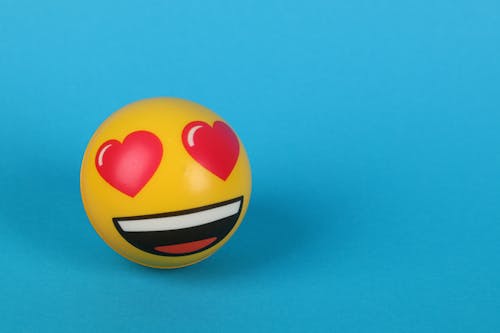 Free A Love Emoticon on Blue Surface Stock Photo